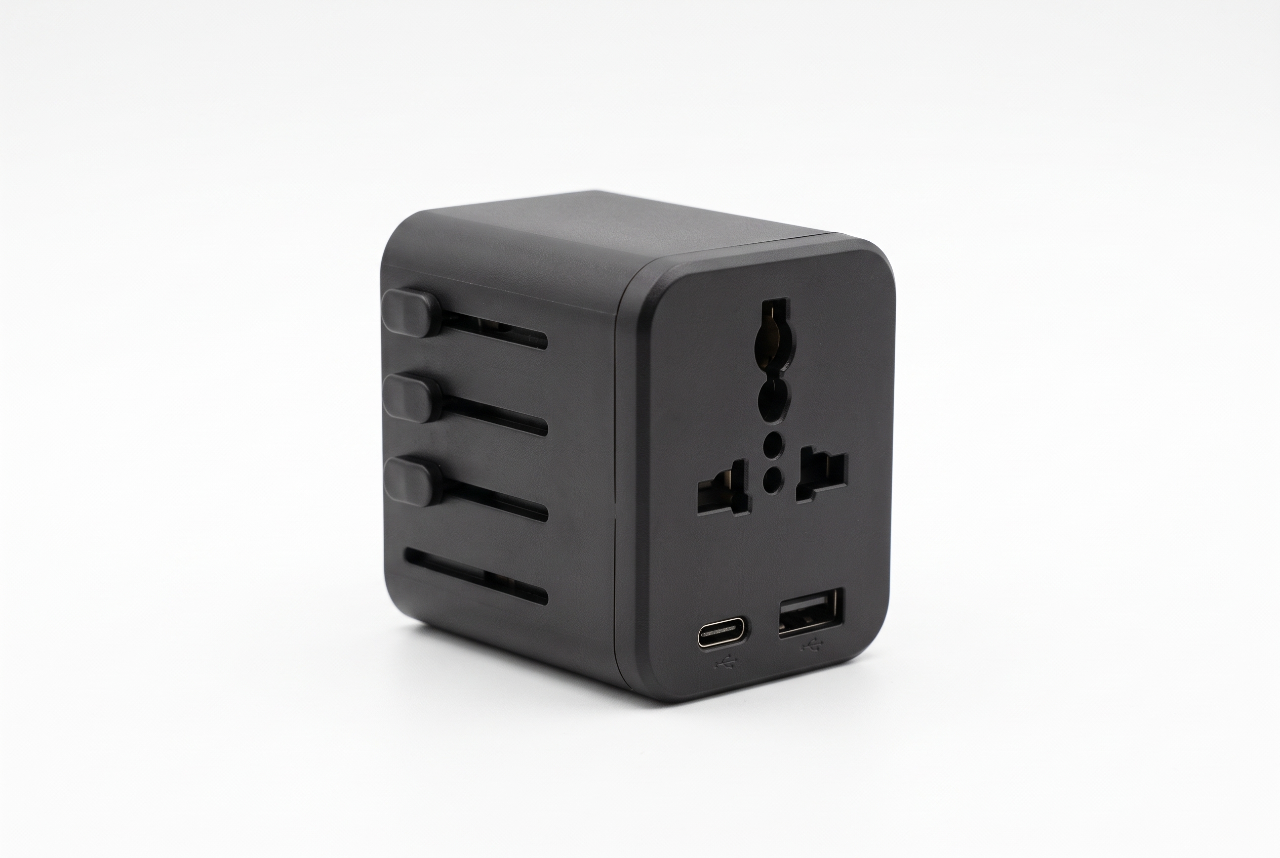 Clean white-background product image of a black universal travel adapter for an ecommerce listing